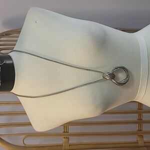 Silvertone snake chain necklace with hoop pendants